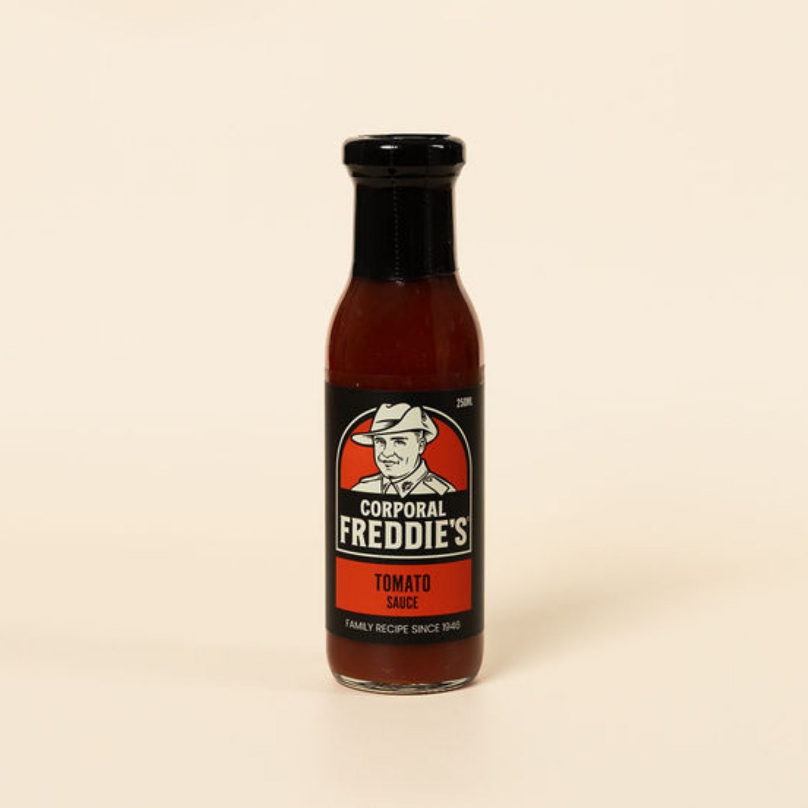 Bottle of Corporal Freddie's Tomato Sauce on a beige background
