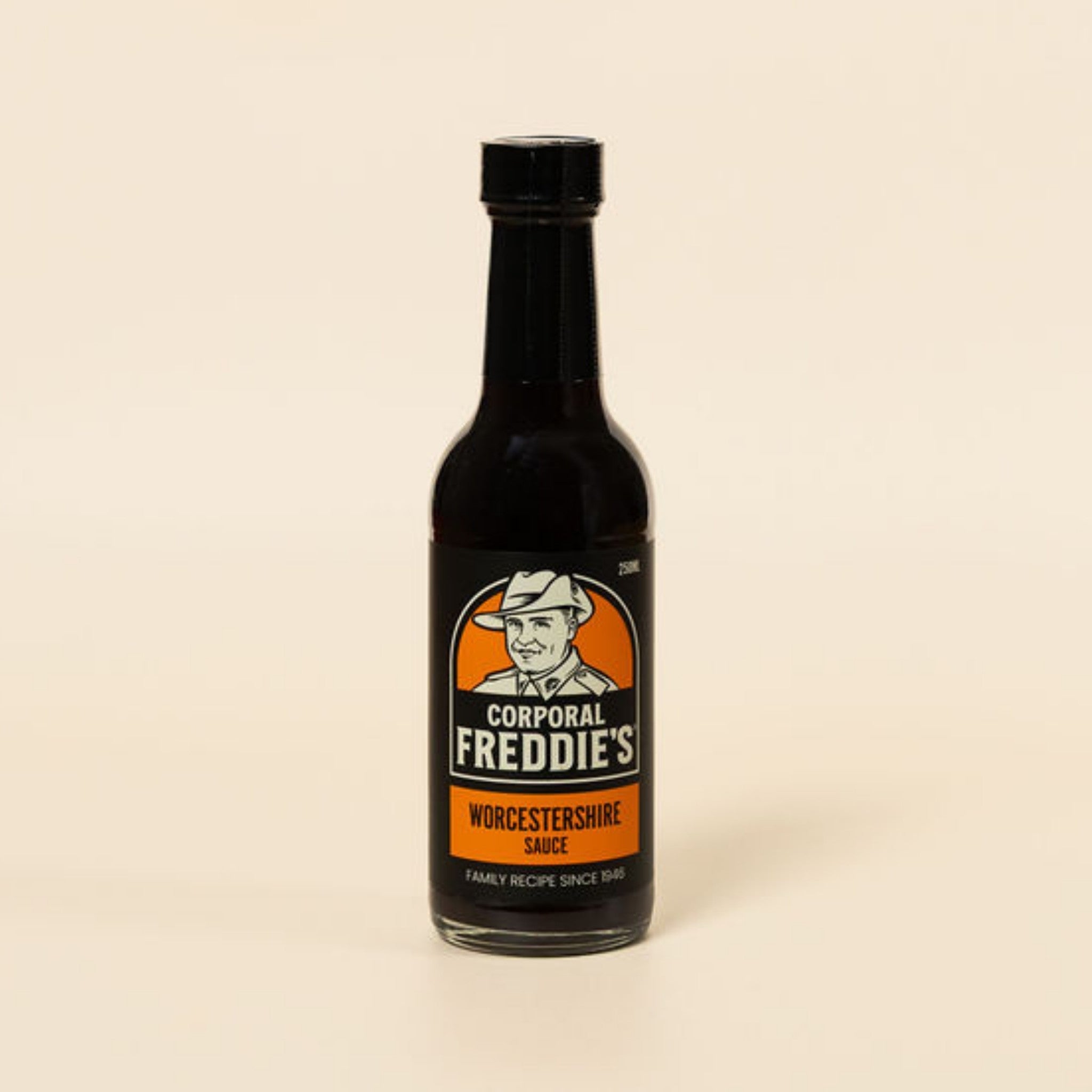 Bottle of Corporal Freddie's Worcestershire sauce on a beige background