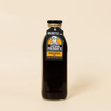 Bottle of 750ml Corporal Freddie's Worcestershire sauce on a beige background