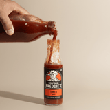 pouring refill bottle into 250ml Tomato Sauce bottle